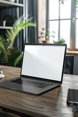 A laptop with white screen on the working table
