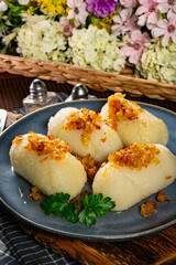 Kartacze - potato dumplings stuffed with minced meat.