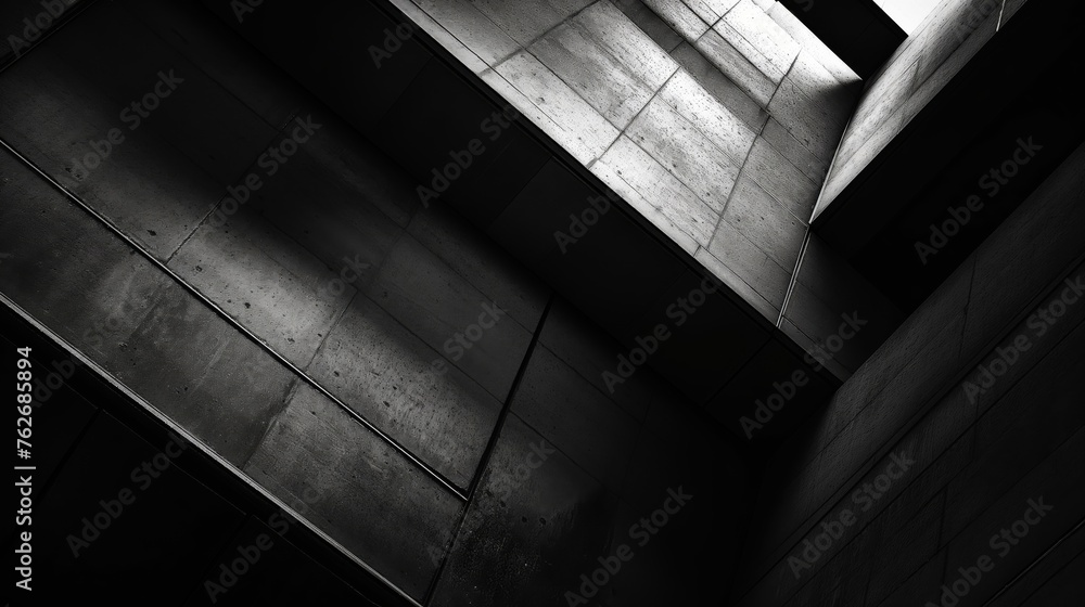 Poster monochrome image showcasing a dynamic contrast of light and shadows in a modern concrete structure