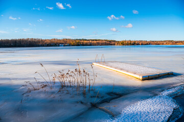 Jetty and a frozen lake © ChristianL