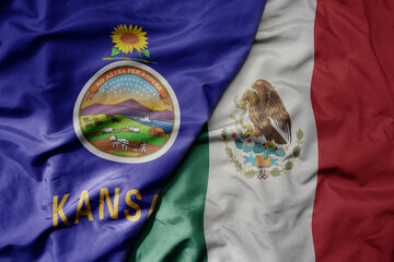 big waving realistic national colorful flag of kansas state and national flag of mexico .