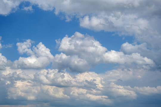 blue sky with white clouds, sky scenery, sunlit clouds