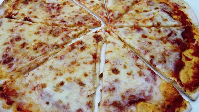 pizza italian margherita slices closeup rotating