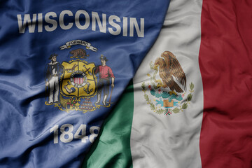 big waving realistic national colorful flag of wisconsin state and national flag of mexico .