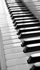 Detailed monochrome close up of a black and white piano keyboard in an intricate view