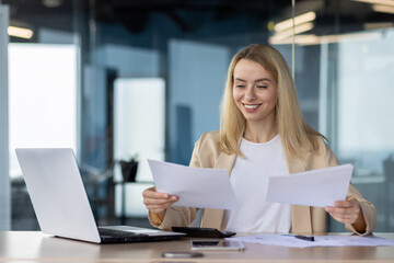 Professional woman reviewing documents in office setting