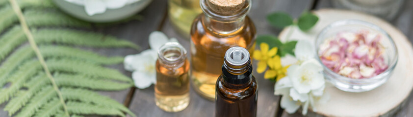 Concept of pure organic essential oil in glass bottles in cosmetology. Moisturising skin care,...