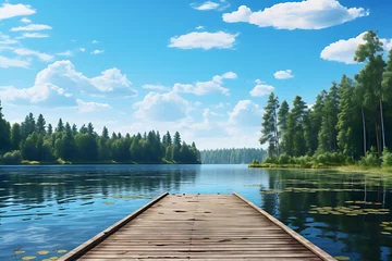 Muurstickers Wooden pier on a lake with forest in the background and blue sky © Creative
