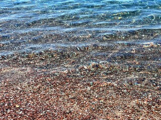 Sea clear water and pebbles