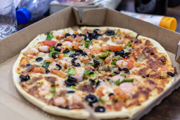 Pizza in a cardboard box - 762746472