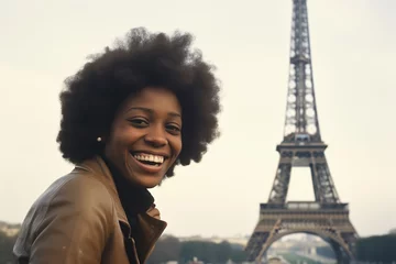  Black woman smiling at Eiffel Tower in Paris in 1970s © blvdone