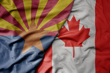 big waving realistic national colorful flag of arizona state and national flag of canada .
