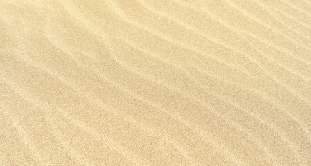 Fototapeta na wymiar Wave sand texture, abstract background of sand on the beach 