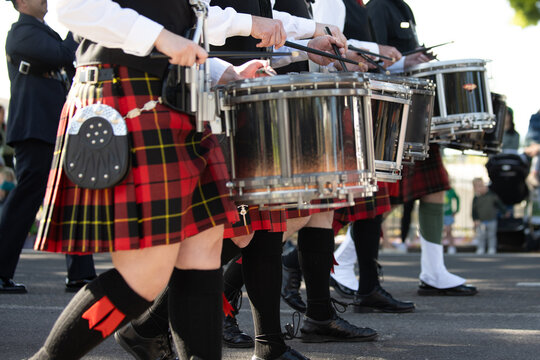 Irish drum line wearing kilts and spats in honor of the Irish tradition during the St Patricks Day parade