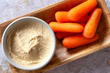 Fotobehang Garlic Hummus with Baby Carrots © Michelle