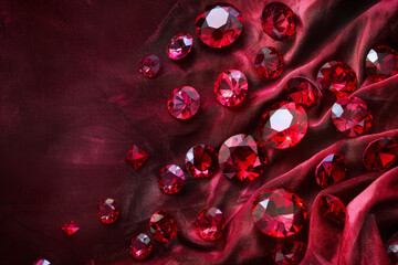 An abstract background featuring a cascade of ruby gemstones against a velvet backdrop