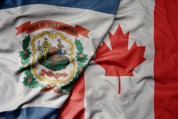 big waving realistic national colorful flag of west virginia state and national flag of canada .