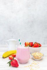 Strawberry milkshake smoothie with banana and oatmeal. Healthy breakfast. Dietary and healthy menu. 