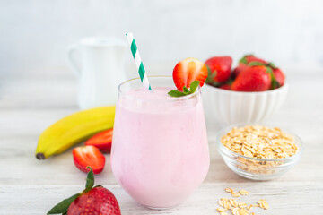 Strawberry milkshake smoothie with banana and oatmeal. Healthy breakfast. Dietary and healthy menu. 