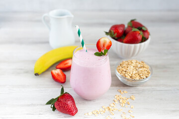 Strawberry milkshake smoothie with banana and oatmeal. Healthy breakfast. Dietary and healthy menu. 