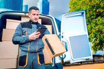 Man courier in downtown. Delivery guy holds package. Courier stands near skyscrapers. Delivery...