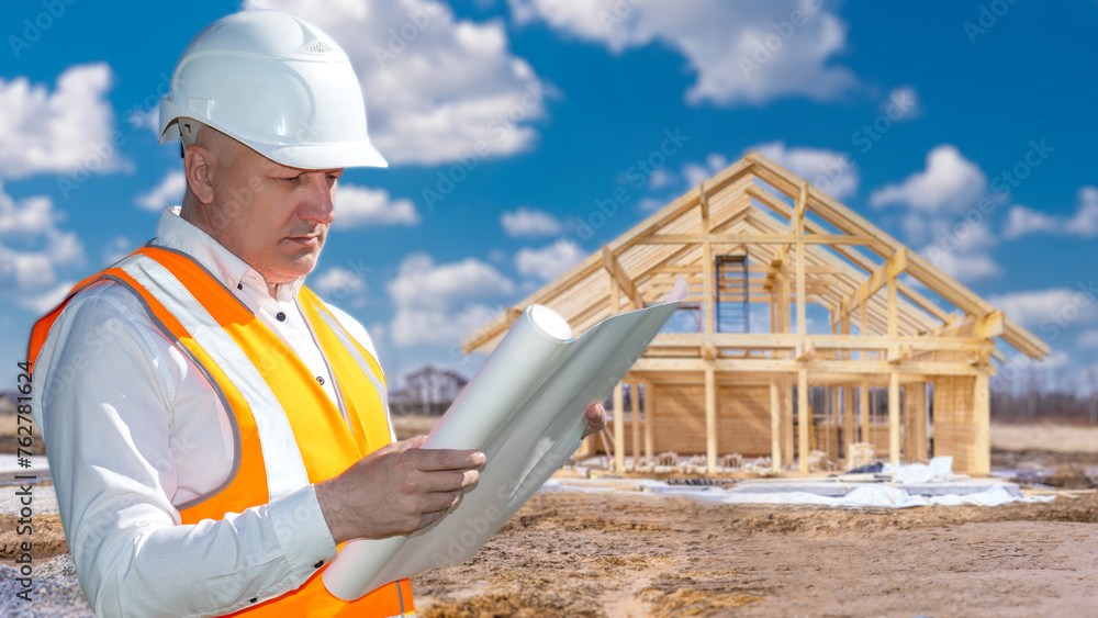 Aufkleber man builder. architect reads engineering drawings. builder stands near wooden house under constructi