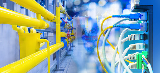 Network equipment inside factory. Gas pipes near internet switch. Network equipment for factory...