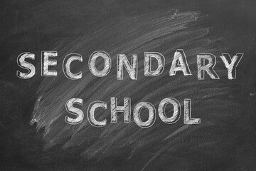 Secondary school. Text on blackboard