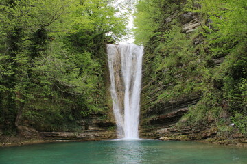 Fototapeta na wymiar Waterfall in the forest.Beautiful landscape of the waterfall of Tatlica Erfelek district, Sinop, in the Black Sea Region of Turkey. 