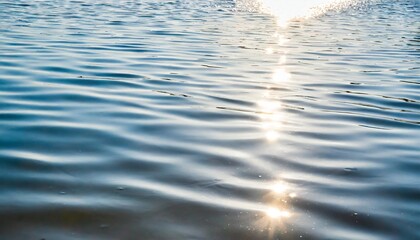 white water with ripples on the surface defocus blurred white colored clear calm water surface texture with splashes and bubbles water waves with shining pattern texture background