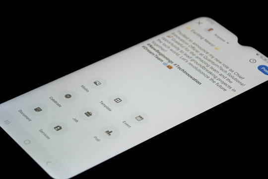 Share a new post on Linkedin, a smartphone screen with a black background, using LinkedIn app on an Android phone, business and success idea: Istanbul, Turkey - 12.03.24