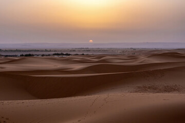 Fototapeta na wymiar Authentic view at sand dunes of the sahara desert in morocco, africa