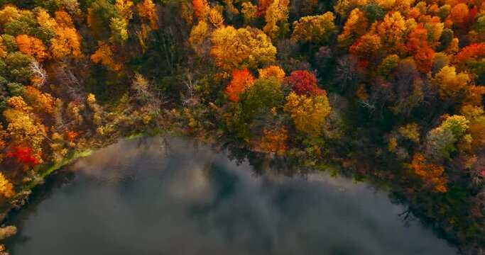 An Aerial Snapshot Captures The Breathtaking Interplay Of A Mist-Veiled River Winding Through A Vibrant Tapestry Of Fall Foliage - White Mountains, New Hampshire