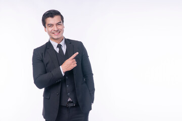 Advertisement gesture pleased concept. Confident positive handsome young businessman wear suit pointing own finger presenting product or copy space while standing over isolated white background.