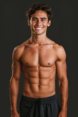 Brutal man with pumped up muscles, vertical portrait. Backdrop with selective focus and copy space