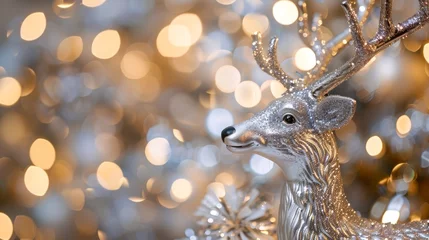 Poster Im Rahmen christmas deer silvery toy decoration with garland lights background © Orkhan