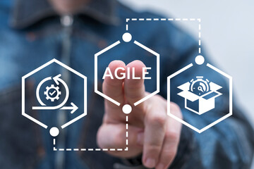 Man using virtual touch screen presses word: AGILE. Agile concept. Agile Development Methodology Business Technology.