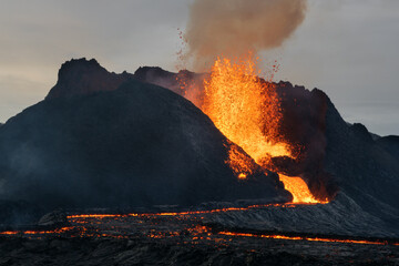 Volcanic eruption explosion and lava flow in the lava field of Fagradalsfjall, Geldingadalir, ...