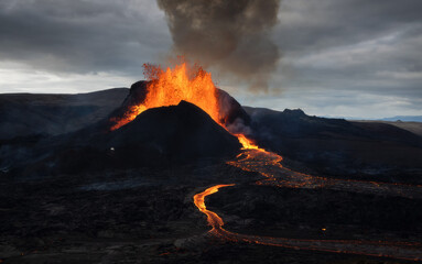 Volcanic eruption explosion and lava flow in the lava field of Fagradalsfjall, Geldingadalir, ...