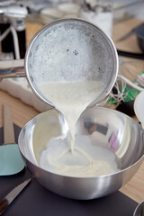 Pouring Cream Mixture with Vanilla into Bowl