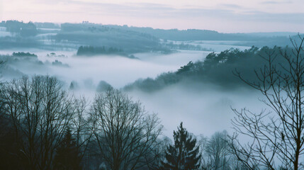 Fototapeta na wymiar Analogue Still High Angle Shot of A Foggy Hill Landscape