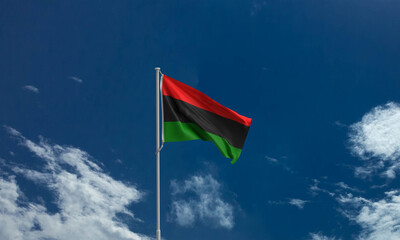 Junteenth 19 nineteen day june flag icon african american symbol blue sky cloudy white copy space patriotic equality united history racism emancipation human right jubilee federal heritage struggle 