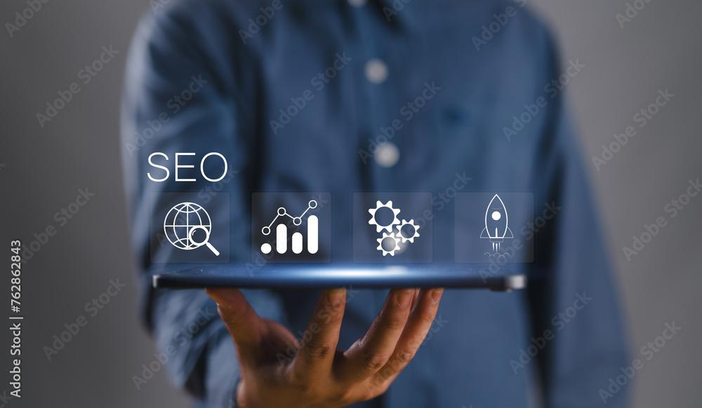 Poster SEO concept, Promoting ranking traffic on website and optimizing your website to rank in search engines. Businessman show SEO icon on virtual screen.