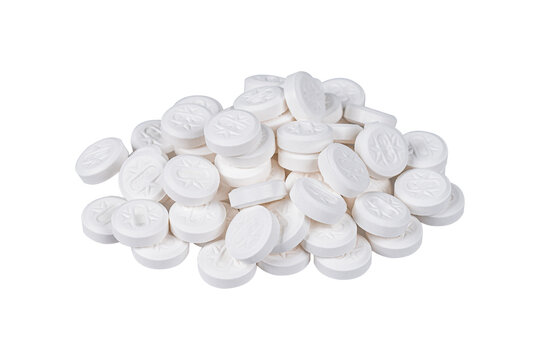 Pile of white round pills isolated on white background.