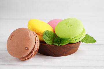 Macaron or french macaroon dessert on white background, cake and cookies on the celebrated birthday.