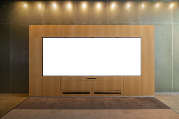 Texture background of a wooden wall unit with a large, horizontal blank display screen: a mockup...