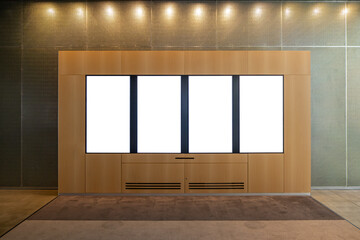 Four Indoor modern Display Panel with Blank Screens in a Wooden Interior. Blank white vertical...