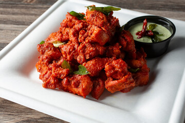 A closeup view of a plate of chicken 65.