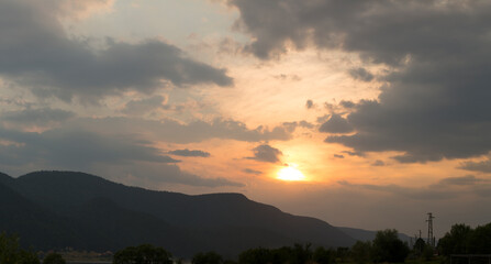 Sunset over the town of Sarnitsa, located in the Western Rhodope Mountains near the Dospat Reservoir.