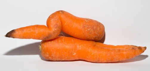 Two crooked carrots are mutants. Association of erotic intimacy.